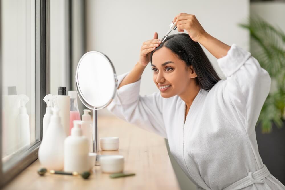 applying scalp serum